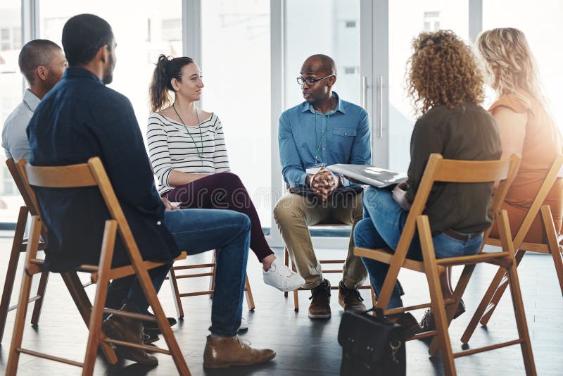 Diverse group therapy session with Black and White participants